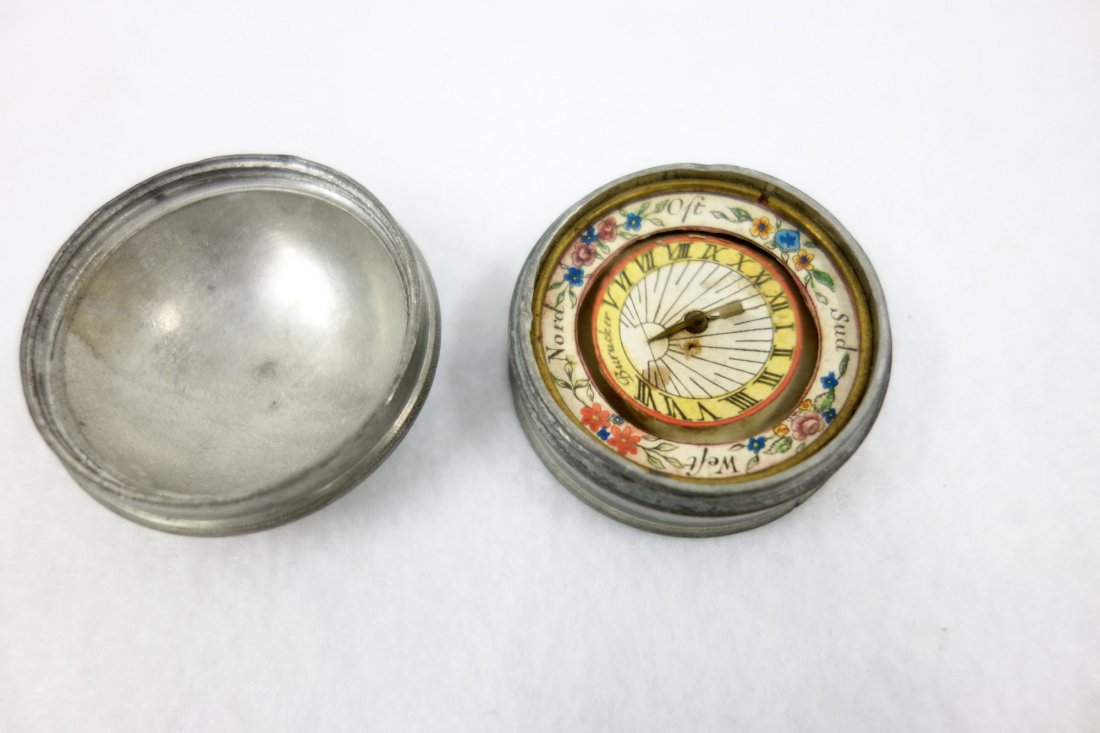 Small pocket compass contained within a pewter case (1 of 3)