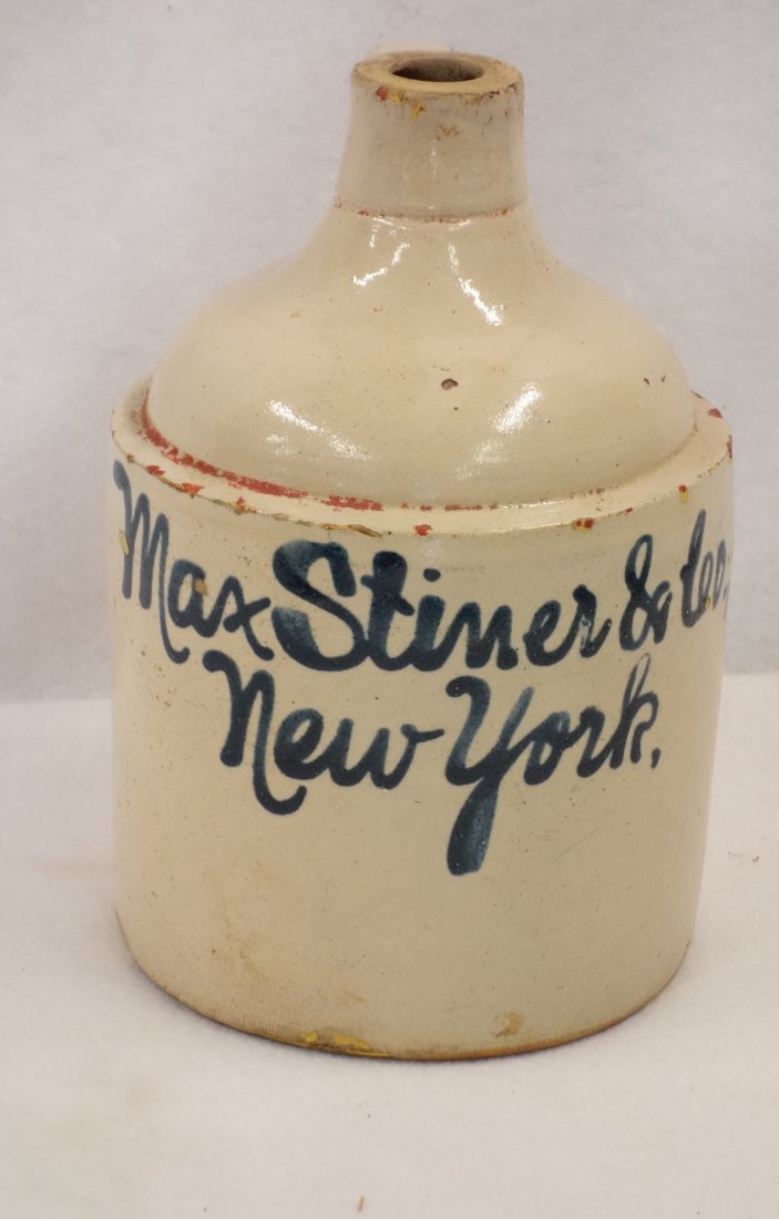 Stoneware advertising 1 gallon jug, written in blue (1 of 2)