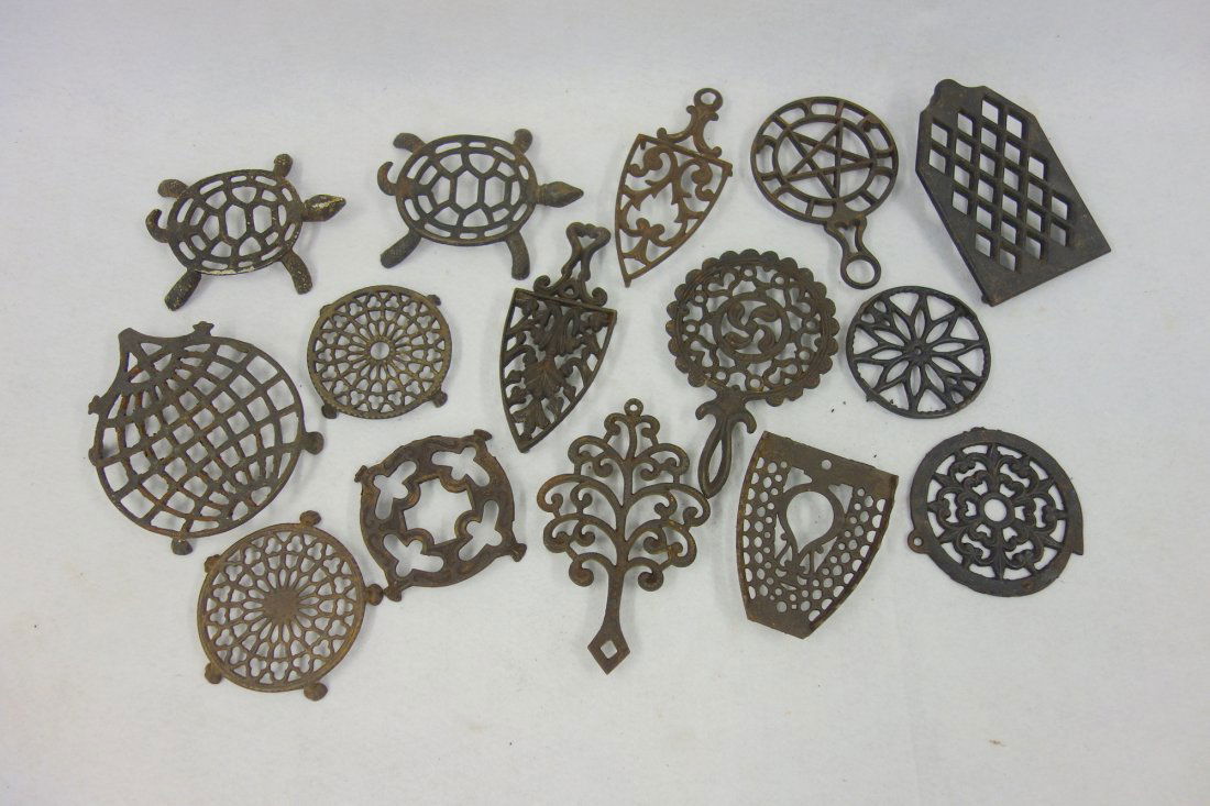 Collection of 15 iron trivets including 2 turtle (1 of 1)