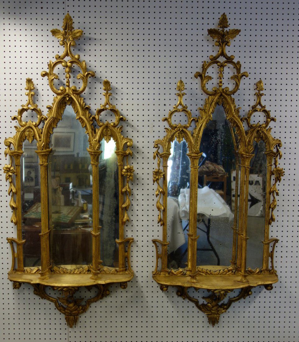 Pair of matching gilded wall mirrors decorated with (1 of 10)