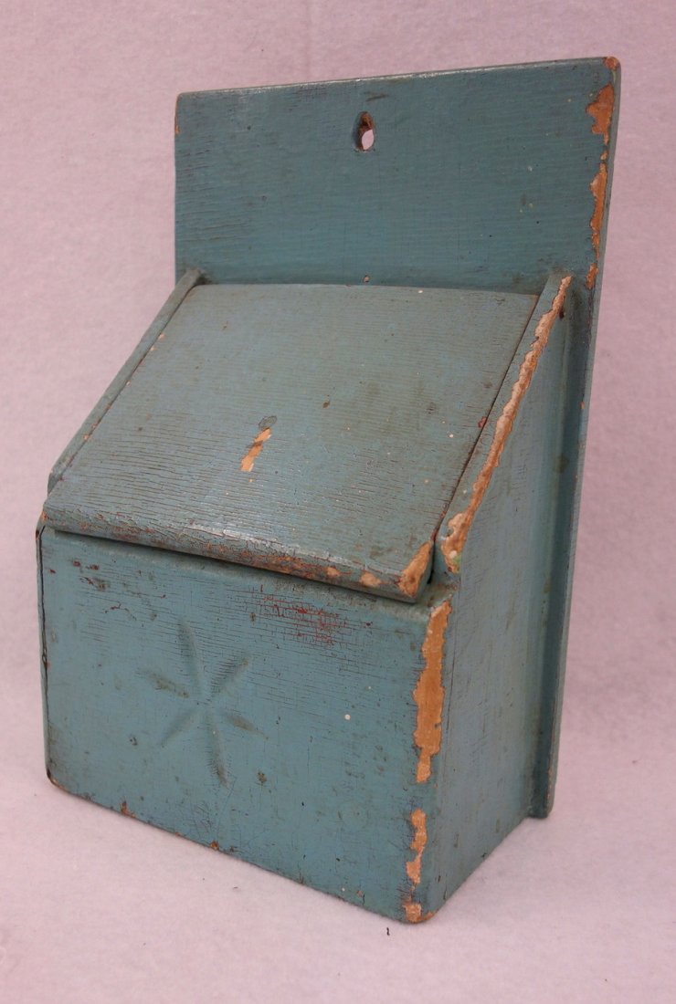 Old salt box in old robins egg blue paint. Carved snow (1 of 3)