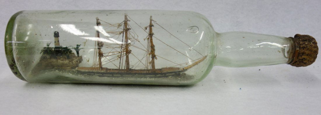 19th century ship in a bottle with an island and light (1 of 4)