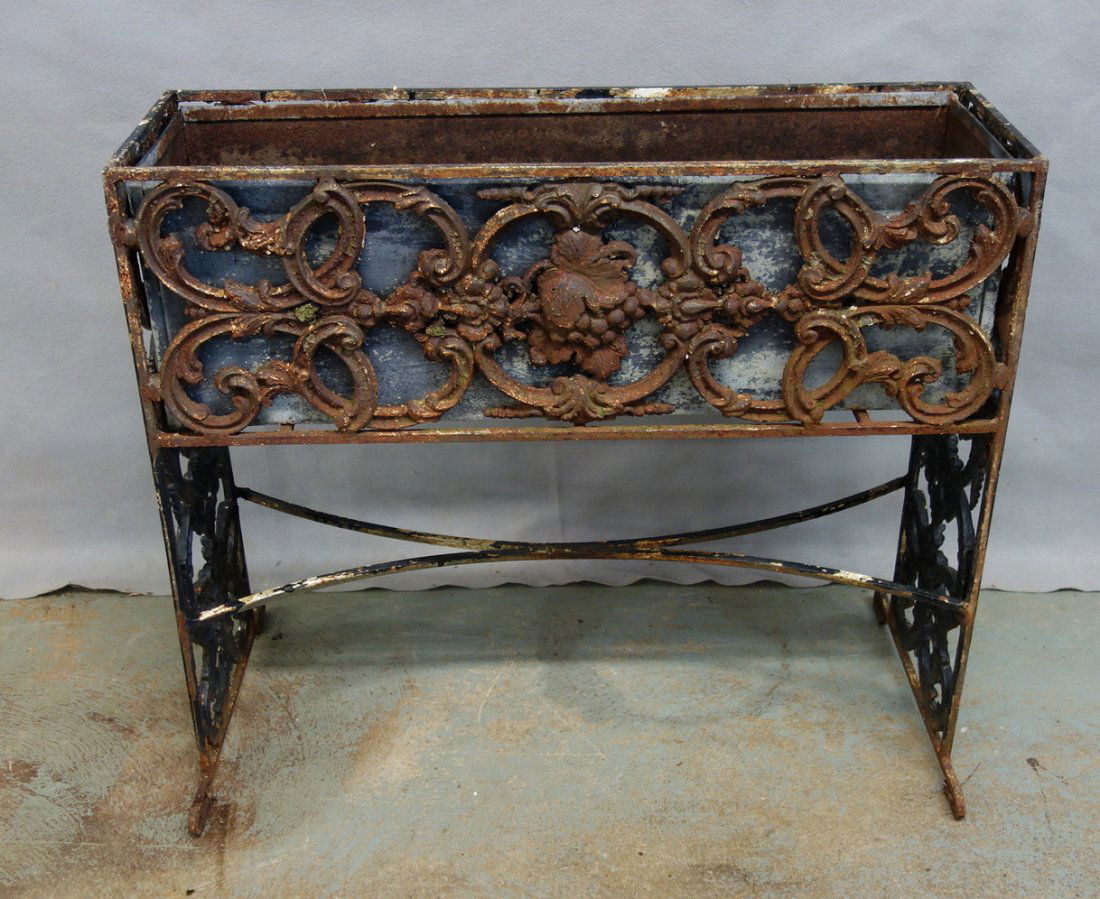 Ornate cast iron planter in old black paint with tin (1 of 5)