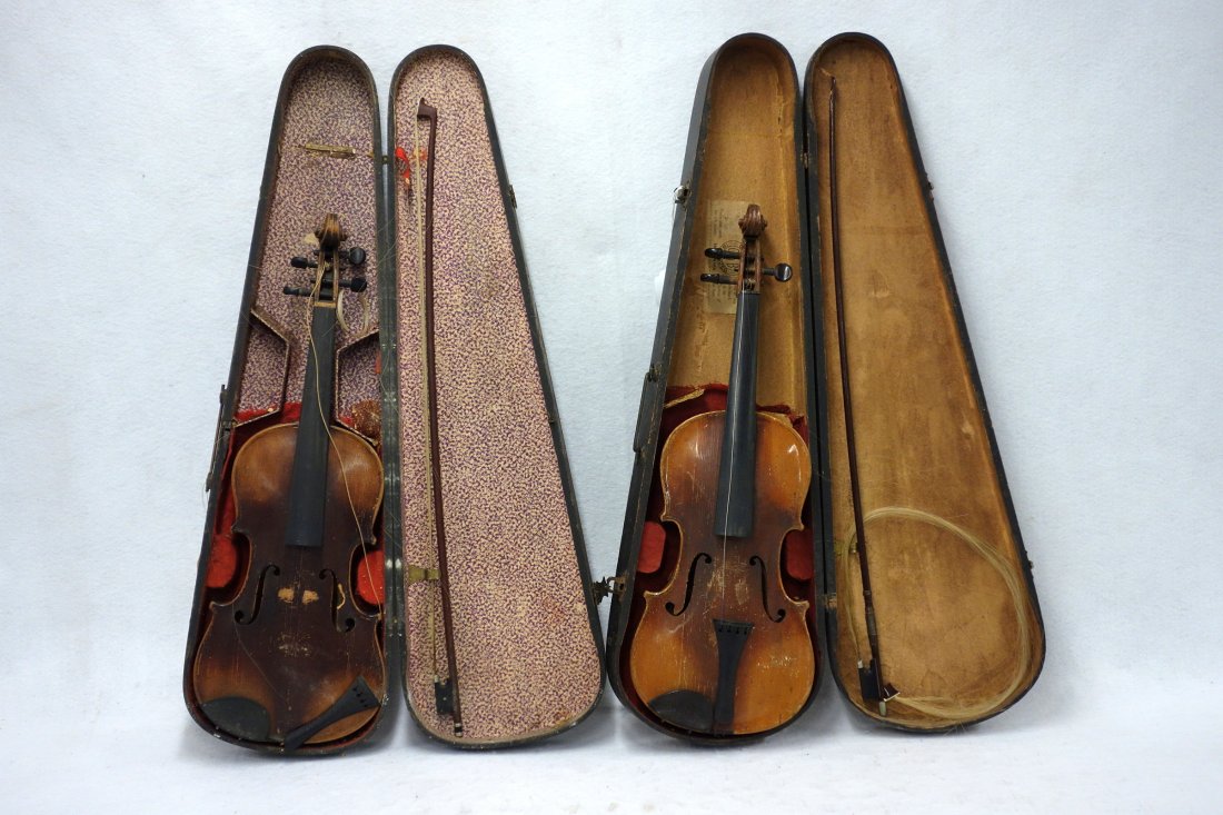 Two old violins late 19th to early 20th century: 1): Two old violins late 19th to early 20th century: 1) Paper label "Antonius Stradivarius Cremonensis Faciebat Anno 1734" - use wear, 1.25" chip to scroll, missing one peg otherwise good condition - with