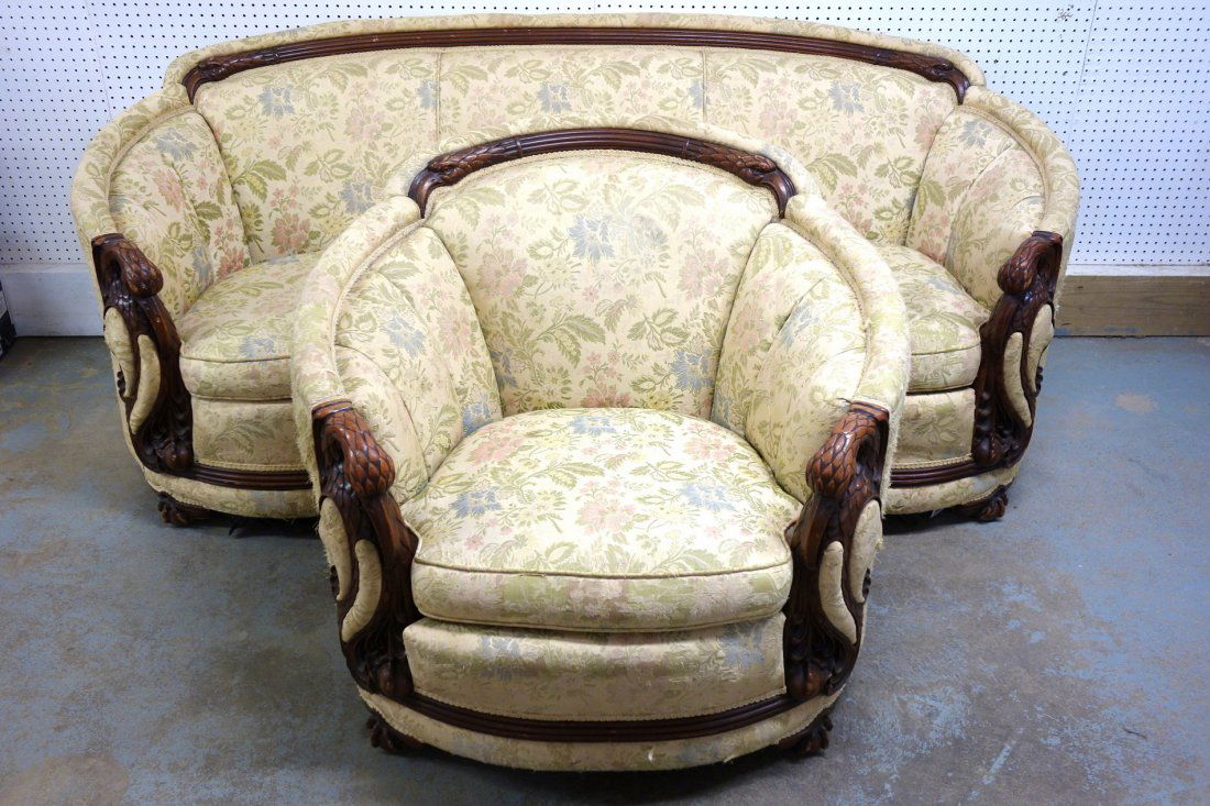 Unusual upholstered serpentine shaped couch - 39"W x: Unusual upholstered serpentine shaped couch - 39"W x 82"L with carved stylized eagle arms and eagle crest, with matching parlor chair with similar carvings. Claw and ball feet. Some upholstery scratch