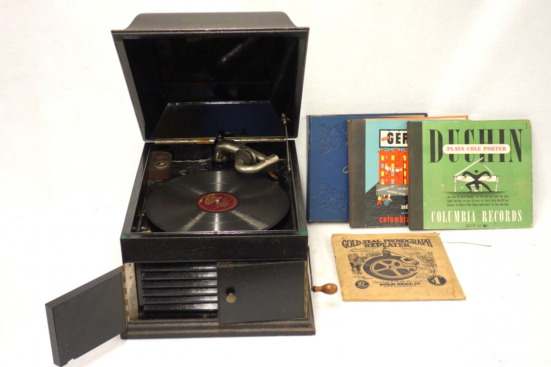 Victor Victrola Style #VV-VIII model # 24522 B with a: Victor Victrola Style #VV-VIII model # 24522 B with a "Gold Seal Phonograph Repeater" in original envelope. Comes with records including Gershwin. Good working condition.