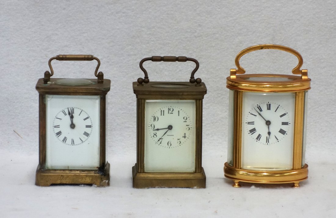 Three carriage clocks including 1) a brass and beveled: Three carriage clocks including 1) a brass and beveled glass case, porcelain Arabic numeral dial marked France, rear plate marked in part Birabent, France, Twelve (12) Jewels, with a star of David, 5.