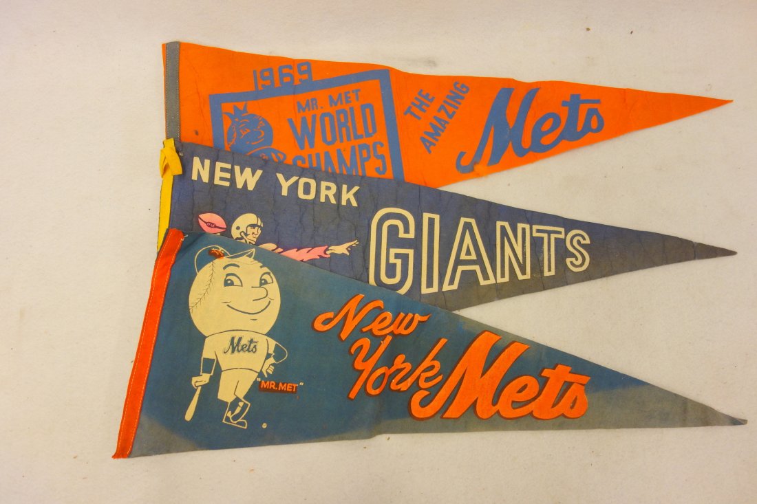 Three NY pennants including two Mets, (1 1969 Mets) and: Three NY pennants including two Mets, (1 1969 Mets) and a 1 NY Giants football, circa 1950-60. All three with wear, folds and stains .