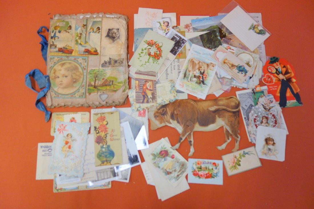 Grouping of ephemera including Raphael Tuck & Sons: Grouping of ephemera including Raphael Tuck & Sons mechanical card "The Bull of the Common Ox" - some lithograph losses, trade card album laid on linen including "America" sailing ship, loose trade ca