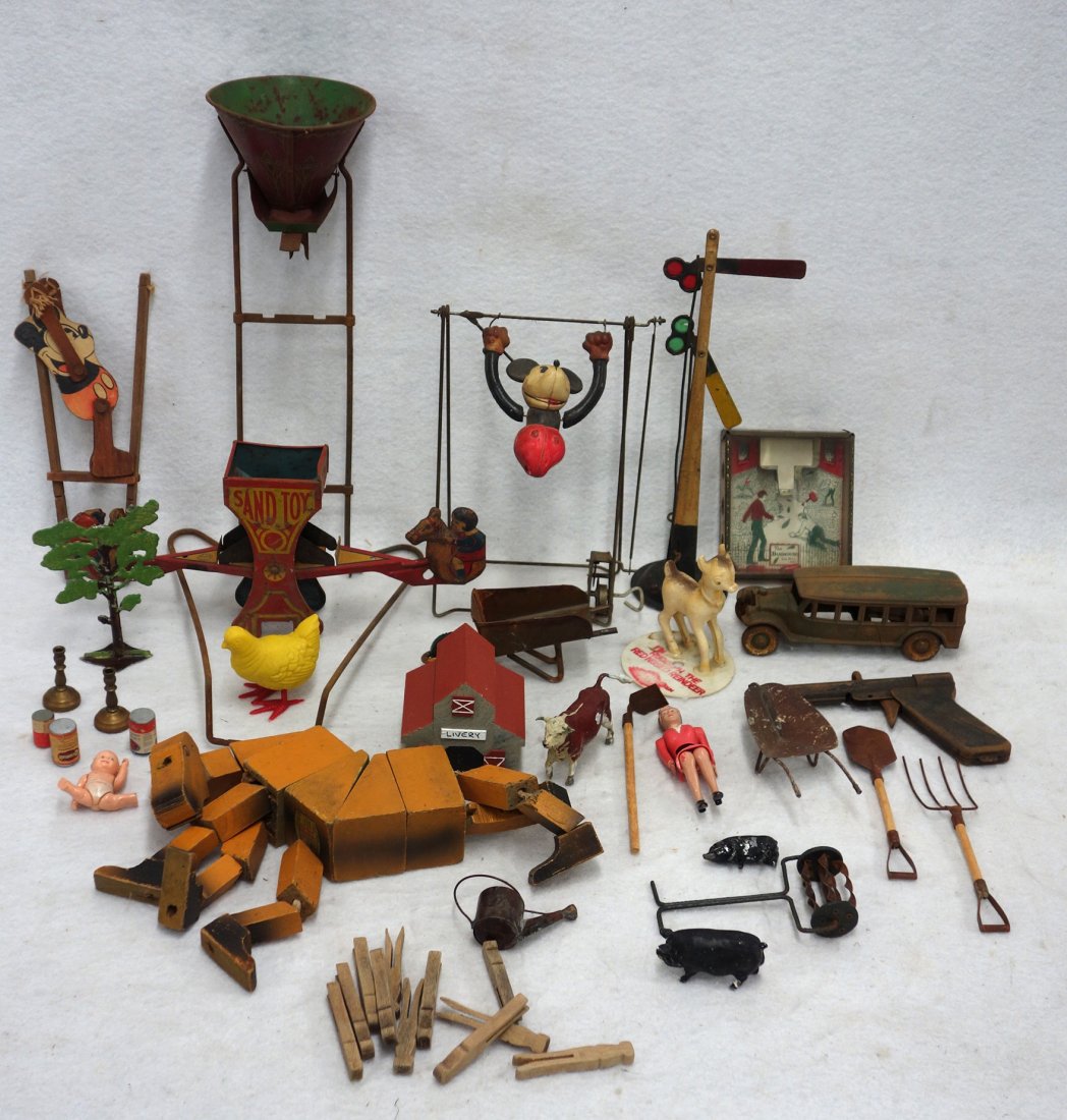Grouping of old toys including a Chein & Co.: Grouping of old toys including a Chein & Co. lithographed tin sand teeter-totter part in very good condition, a Sandy Andy No. 76 lithographed sand hopper part, a 6" Kenton cast iron toy bus with remn
