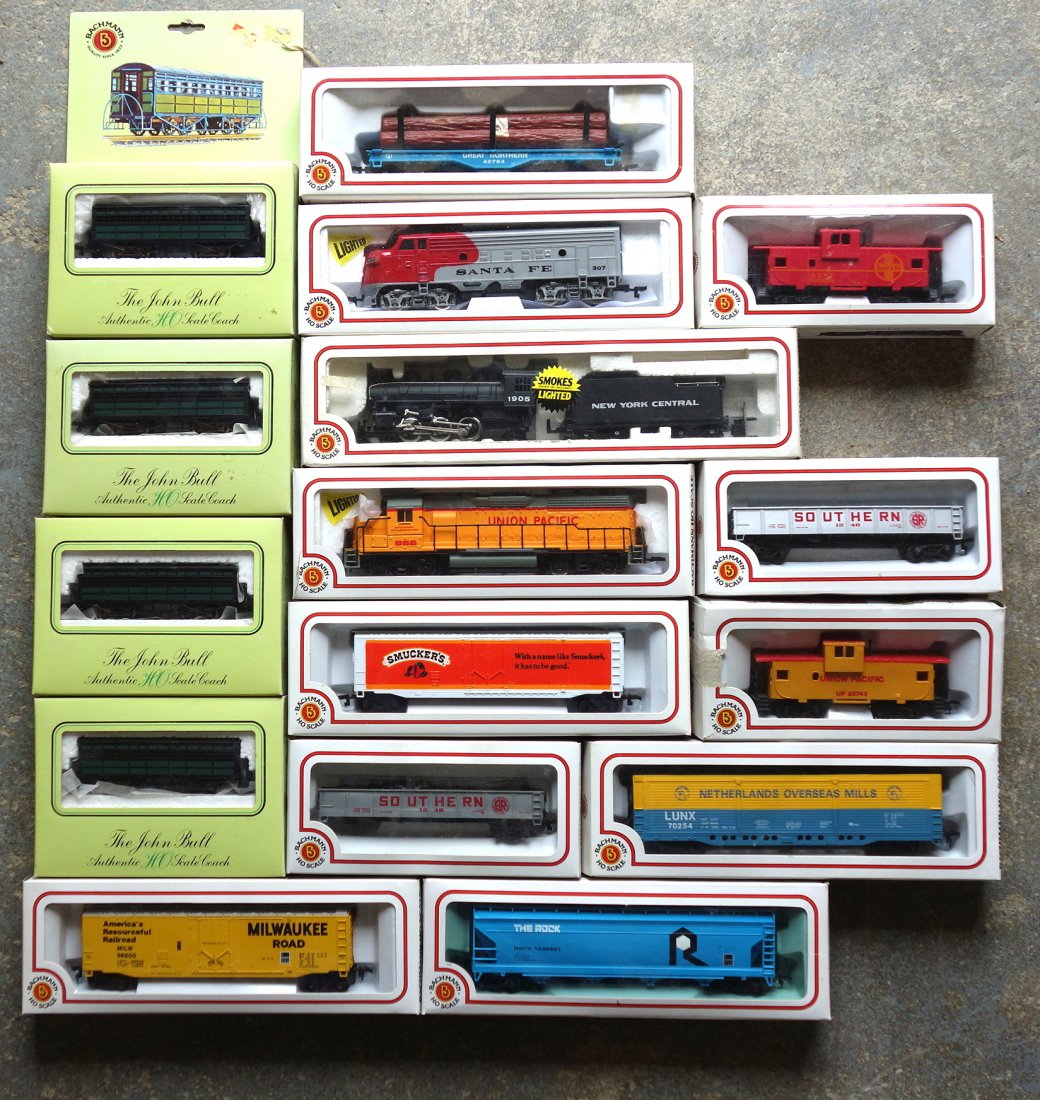 New in the box HO scale engines and cars including: New in the box HO scale engines and cars including Bachman 1905 NYC, Santa fe Union Pacific, thirteen Bachman cars. All are in very good condition.