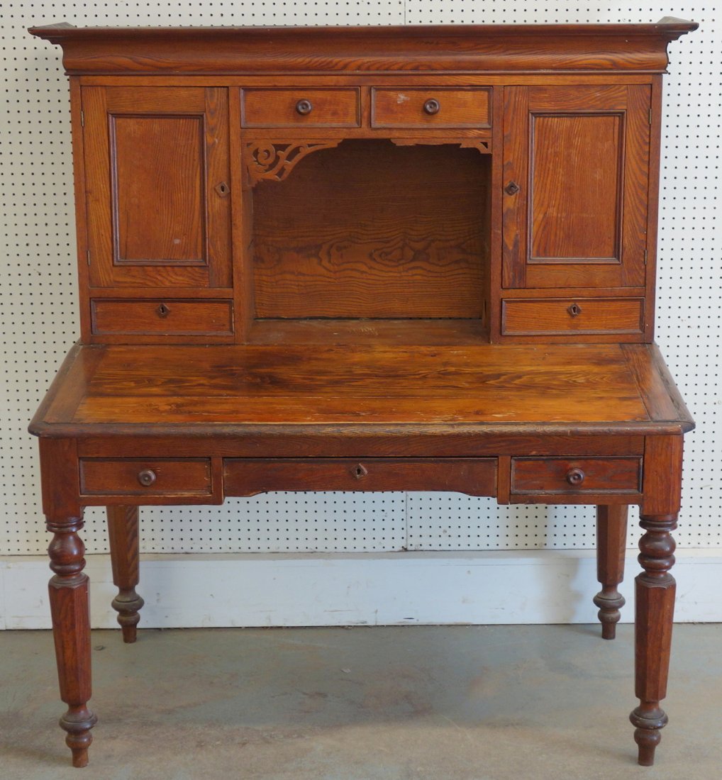 Victorian two piece oak Railroad master's desk with two: Victorian two piece oak Railroad master's desk with two doors and two drawer over three drawers. Pigeon hole interior, octagonal turned legs. 62" H x 54" D x 33"D. Good condition.