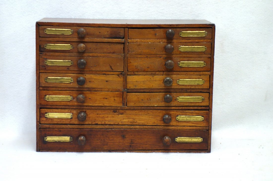 Custom made wooden multi drawer small tool or trinket: Custom made wooden multi drawer small tool or trinket box having 10 small drawers over 2 large drawers. Most drawers with dividers. 16"W x 7.25"D X 12"H. Very good condition. Late 19th to early 20th c