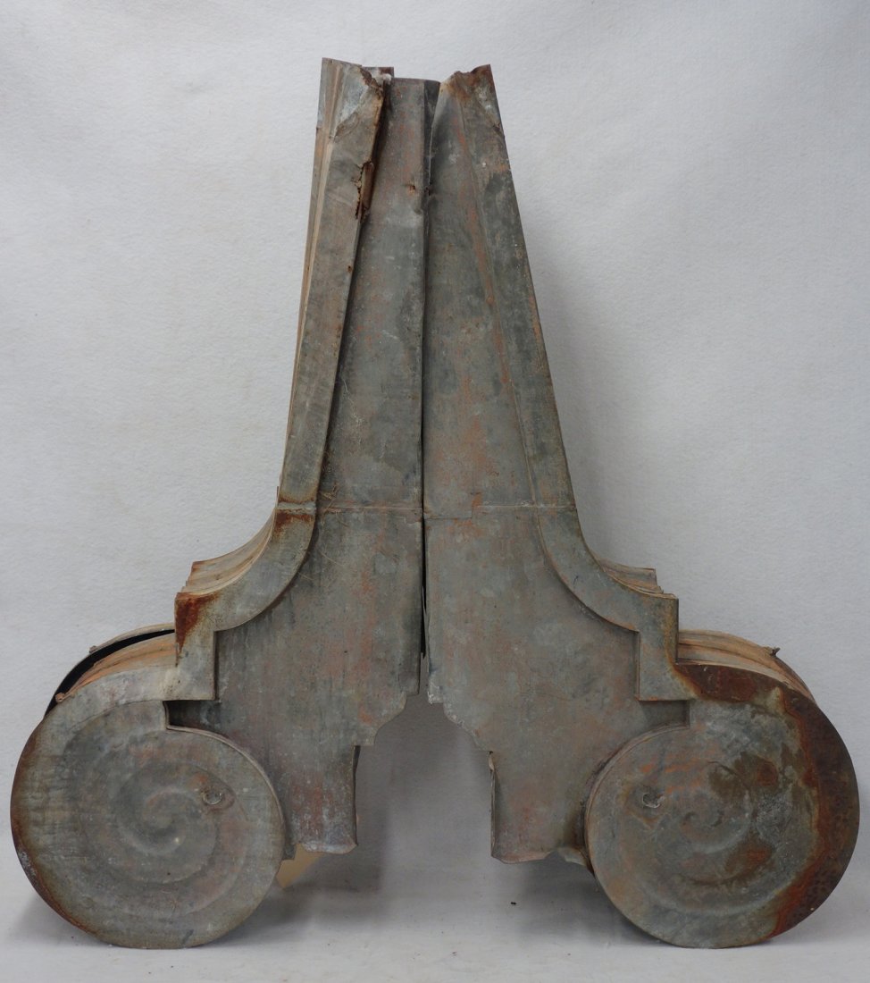 Pair of galvanized tin building ornaments. Late 19th: Pair of galvanized tin building ornaments. Late 19th century, 39"L. Some rust, dings and seam separations.
