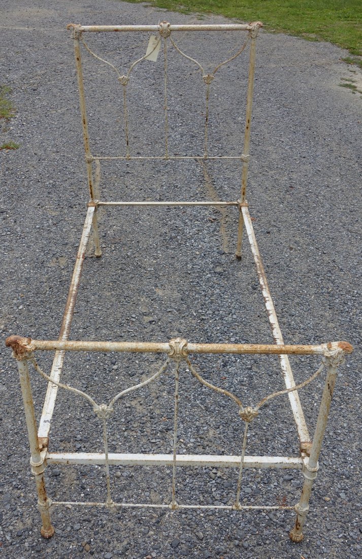 Victorian cast iron bed in white paint - some surface: Victorian cast iron bed in white paint - some surface rust otherwise good condition - twin size.