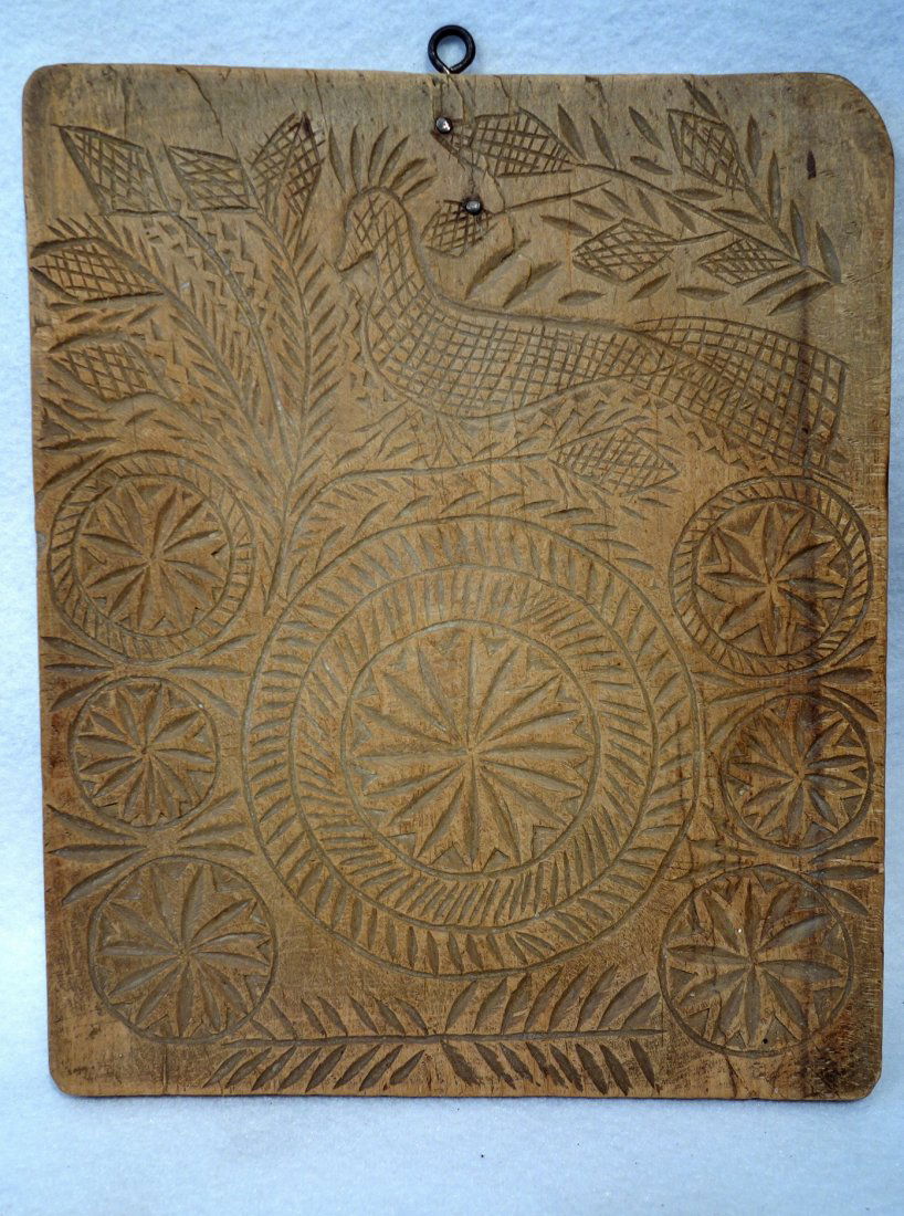 Early wooden cookie mold decorated with flowers within (1 of 4)