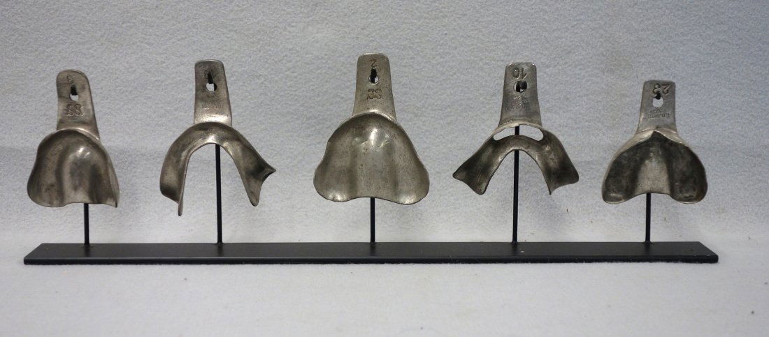 Collection of 5 early metal dental forms, early 20th (1 of 3)