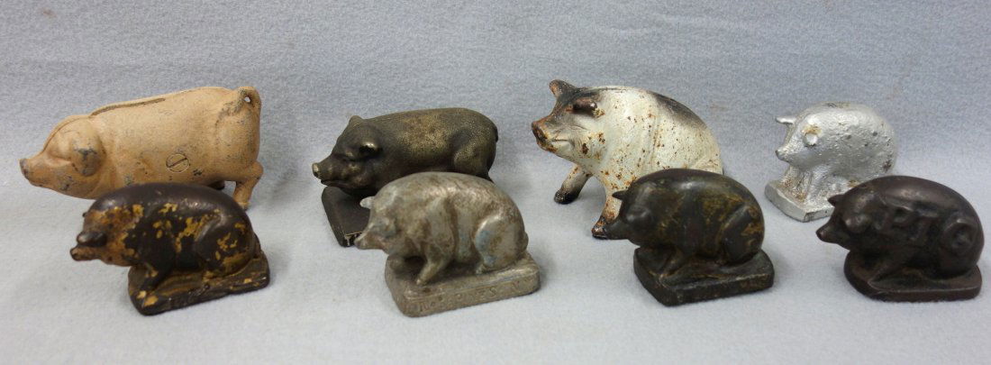 Grouping of 8 figural cast iron pigs including 6 (1 of 8)