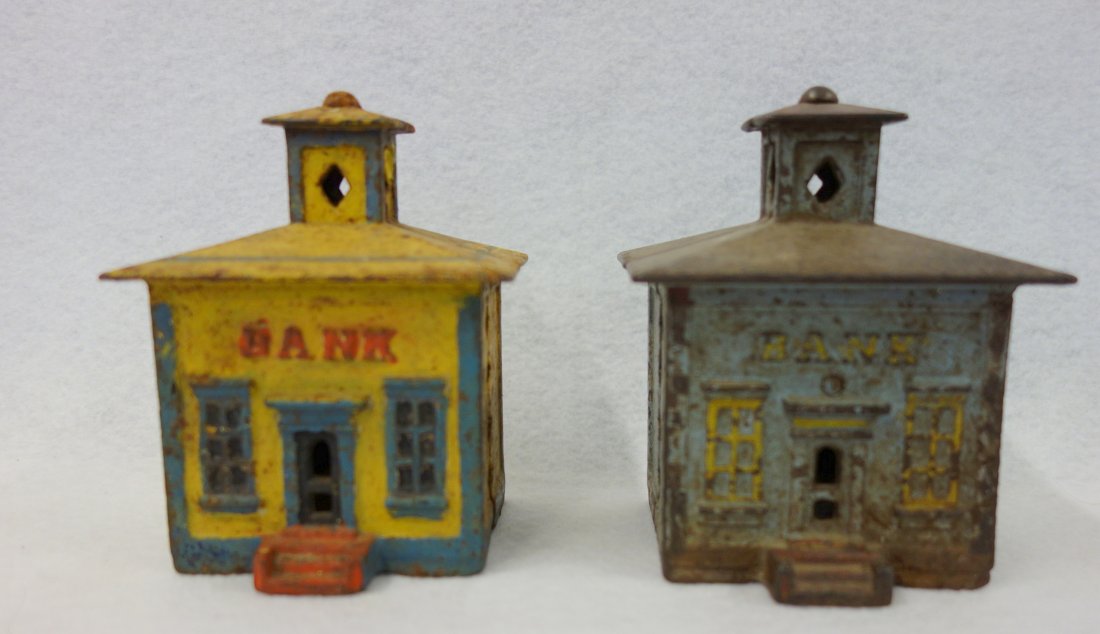 Two cast iron cupola banks by J.E. Stevens, 4 1/8"H. 1) (1 of 5)