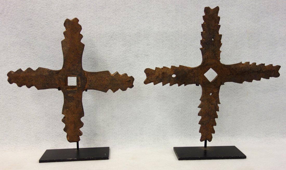 Pair of rare hand forged iron building stars, each with: Pair of rare hand forged iron building stars, each with 4 "rays" - 18th century - 12"D & 11"D. Excellent condition. Both displayed on museum iron mount bases.