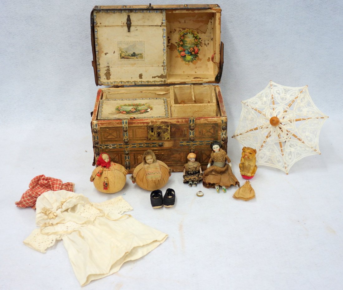 Grouping of doll and toy related collectibles including: Grouping of doll and toy related collectibles including a good doll's trunk, two Soviet Union pin cushion dolls 3 1/2"H, a weighted celluloid roly-poly bulldog, a wooden and lace parasol, two miniatur