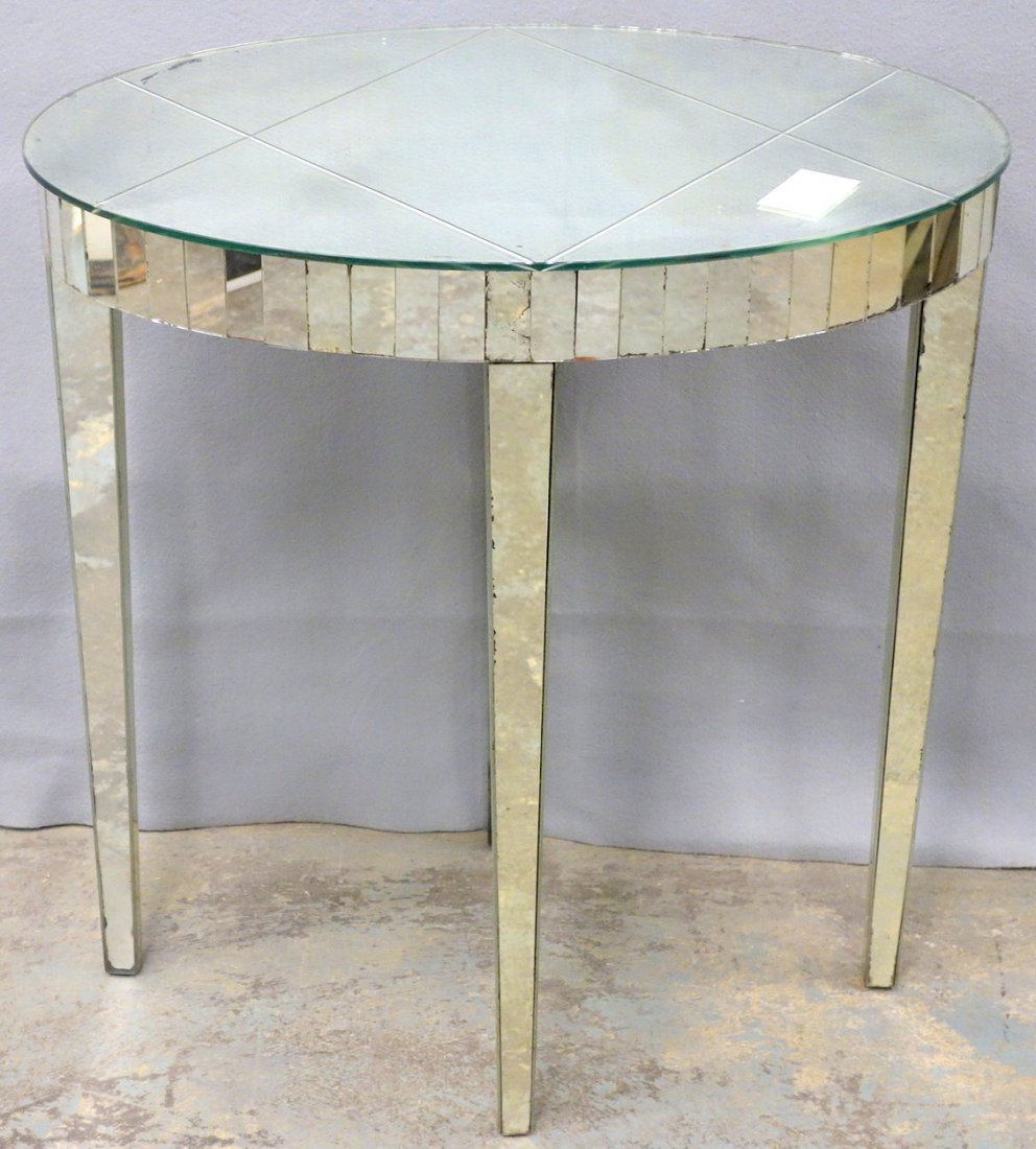 Oval mirrored vanity table circa 1950. 16"W x 24"L x 25: Oval mirrored vanity table circa 1950. 16"W x 24"L x 25 1/4" H. Good overall condition some losses to silvering on mirrors. Provenance: Sam and Grayson Hall. Sam Hall (1921-2014) : Noted screen writer