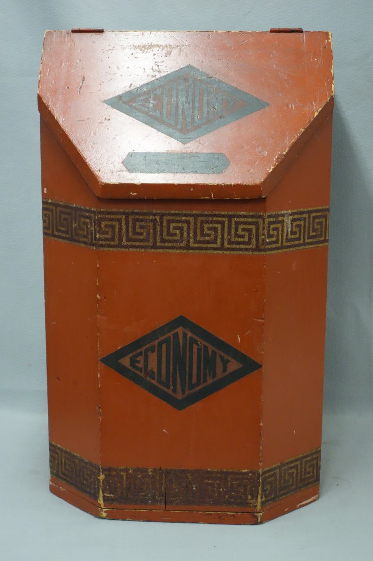 Wooden slant top country store "Economy" coffee bin in: Wooden slant top country store "Economy" coffee bin in old red paint. 30"H x 18"W x 18"D.Late 19th century. Good condition.