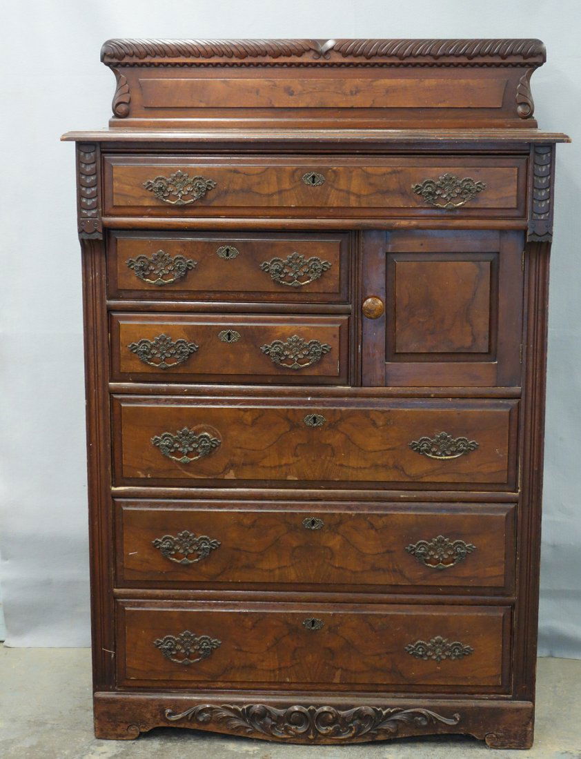 Bonnet chest having a single door, over two drawers and: Bonnet chest having a single door, over two drawers and a door, over three drawers with paneled sides. Circa 1890. 59 14"H x 39 1/2"W x 20"D. Good condition.