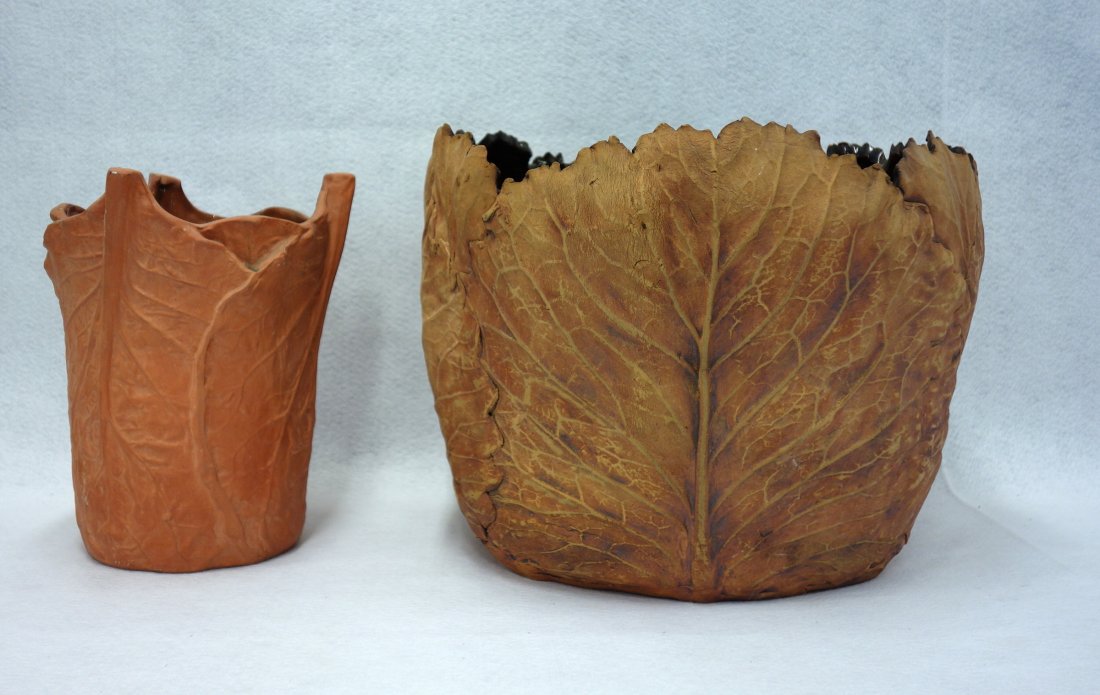Two redware pots with embossed leaf decoration. Unknown: Two redware pots with embossed leaf decoration. Unknown age. One is 10 1/4"H x 8"D, the other is 11 1/2"H x 14 3/4"D. Both are in good condition. Provenance: Sam and Grayson Hall. Sam Hall (1921-2014)