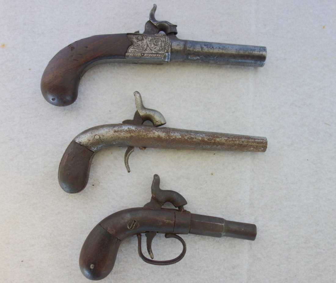 Grouping of three 19th century black powder derringers: Grouping of three 19th century black powder derringers including one English and two others unknown origin. They range in size from 5 1/2" to 7"L. All are in fair condition.