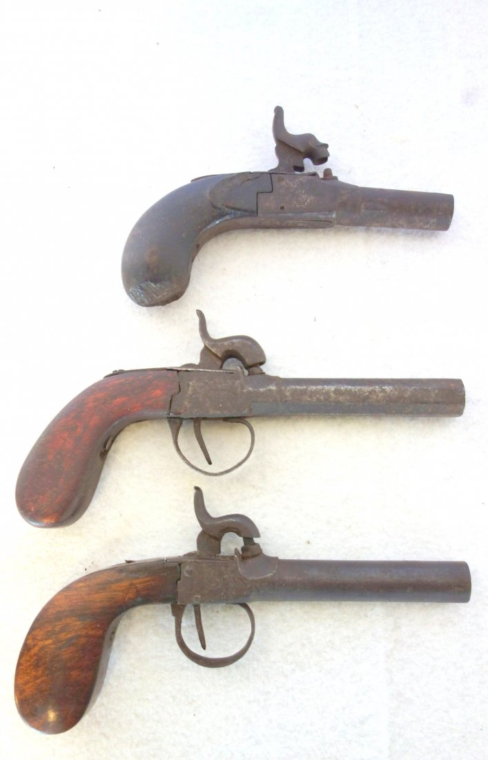 Grouping of three 19th century Belgium black powder: Grouping of three 19th century Belgium black powder derringers ranging in size from 5 3/4"L to 7 1/2"L. All are in fair condition.