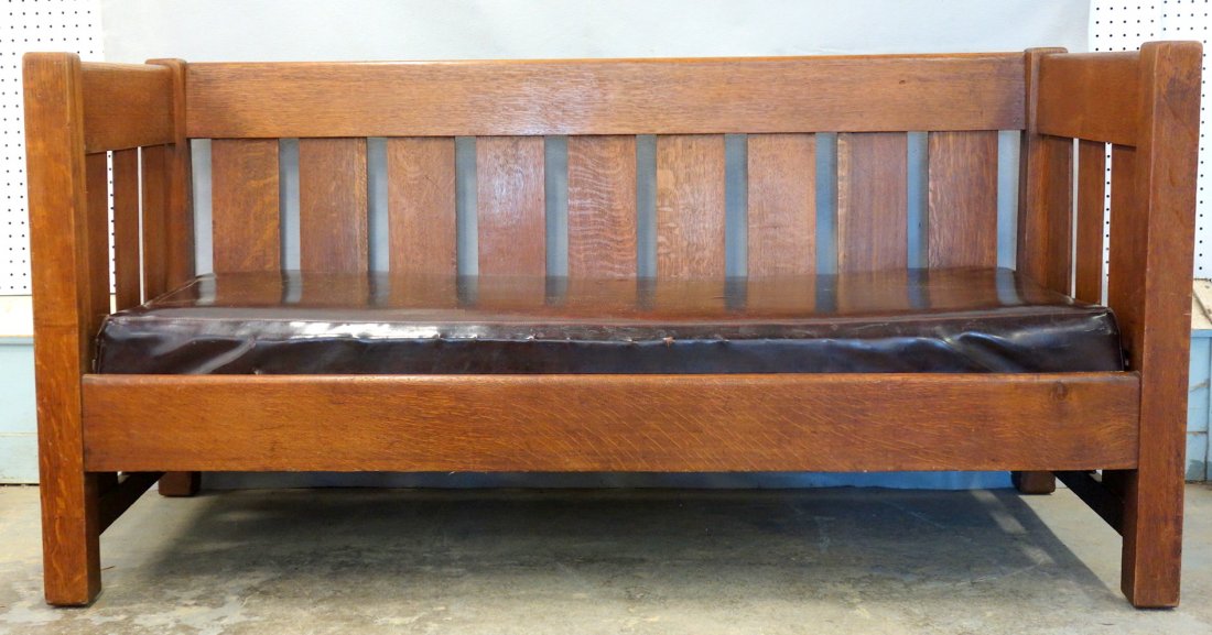 Mission oak settee, refinished, circa 1920, with a: Mission oak settee, refinished, circa 1920, with a newer dark brown naugahyde cushion - 32 1/4"H x 65"W x 27 1/2"D. Not signed. Very good condition.