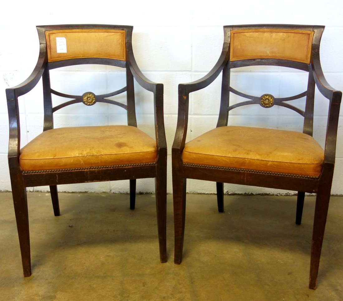 Pair of matching Sheraton arm chairs with leather backs: Pair of matching Sheraton arm chairs with leather backs and seats. Good condition.