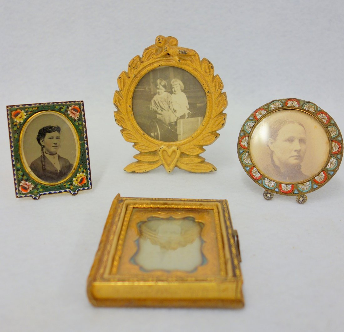 Four small frames with photos including: Daguerreotype: Four small frames with photos including: Daguerreotype of a man, missing cover; a tin type of a woman in a micro mosaic frame 1 7/8" x 2 3/8"; a picture of a woman in a micro mosaic frame 2 5/8"D; and