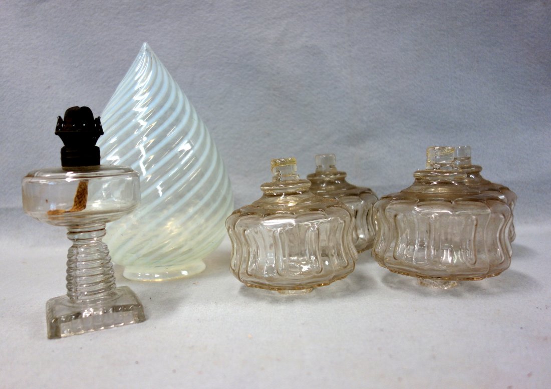 Grouping of six lighting related items including; an: Grouping of six lighting related items including; an opalescent swirl glass globe - 9"H, an early miniature colorless glass oil lamp (font attached to base with wafer) - 6"H and four matching colorles