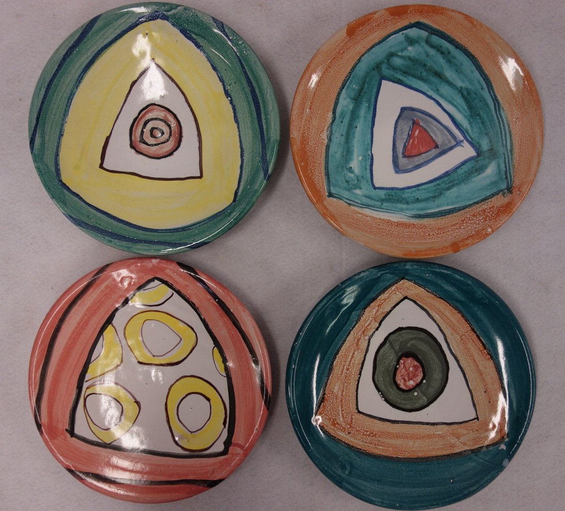 Four art pottery dinner plates signed Karros, 10: Four art pottery dinner plates signed Karros, 10 1/4"Dia., in very good condition. (George Manuel Karos - American late 20th century).Provenance: Sam and Grayson Hall. Sam Hall (1921-2014) : Noted scr