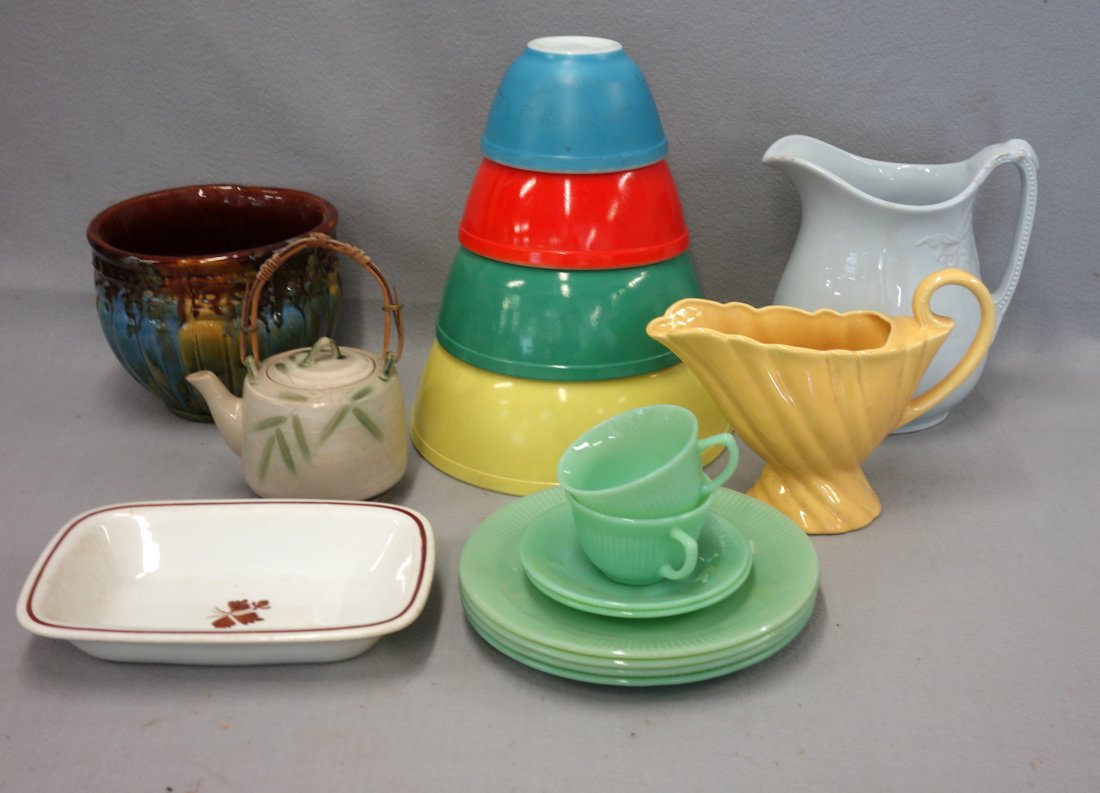 Grouping of miscellaneous pottery and glassware: Grouping of miscellaneous pottery and glassware including: A 19th century Ironstone pitcher, a small tea leaf serving bowl, a set of four graduated Pyrex colorful mixing bowls; oven Fireking green gla