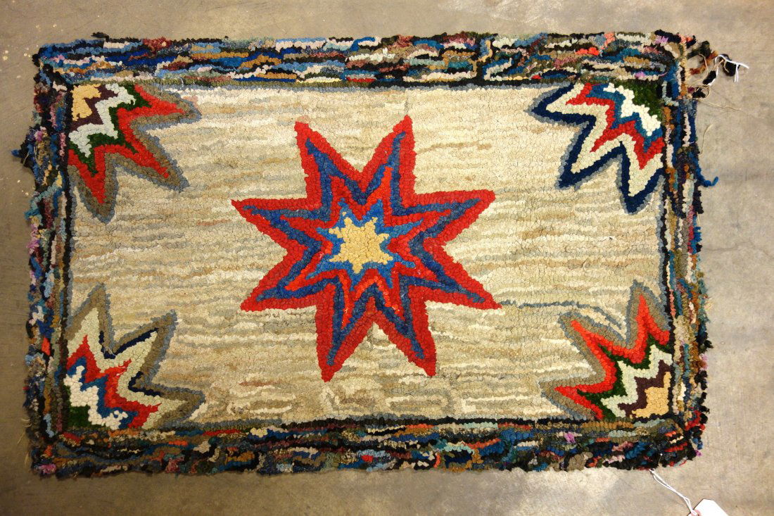 Colorful hooked rug with star center and partial stars (1 of 3)