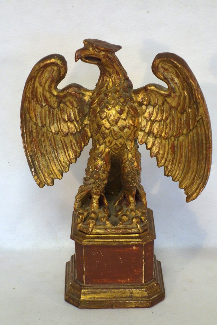 Carved wooden standing spread wing eagle on plinth. (1 of 3)