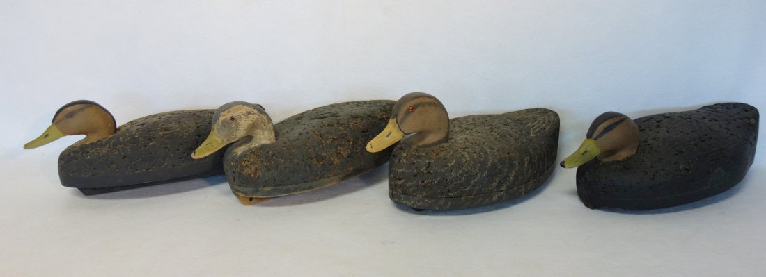 Four black duck decoys, cork bodies - wood heads (1 of 5)