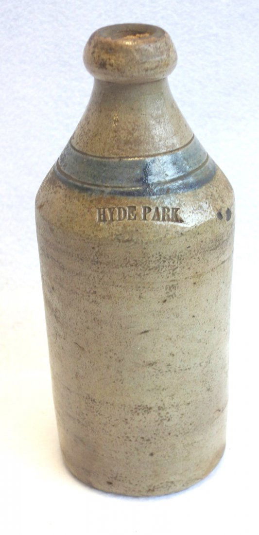Stoneware beer bottle with blue ring around neck with (1 of 2)