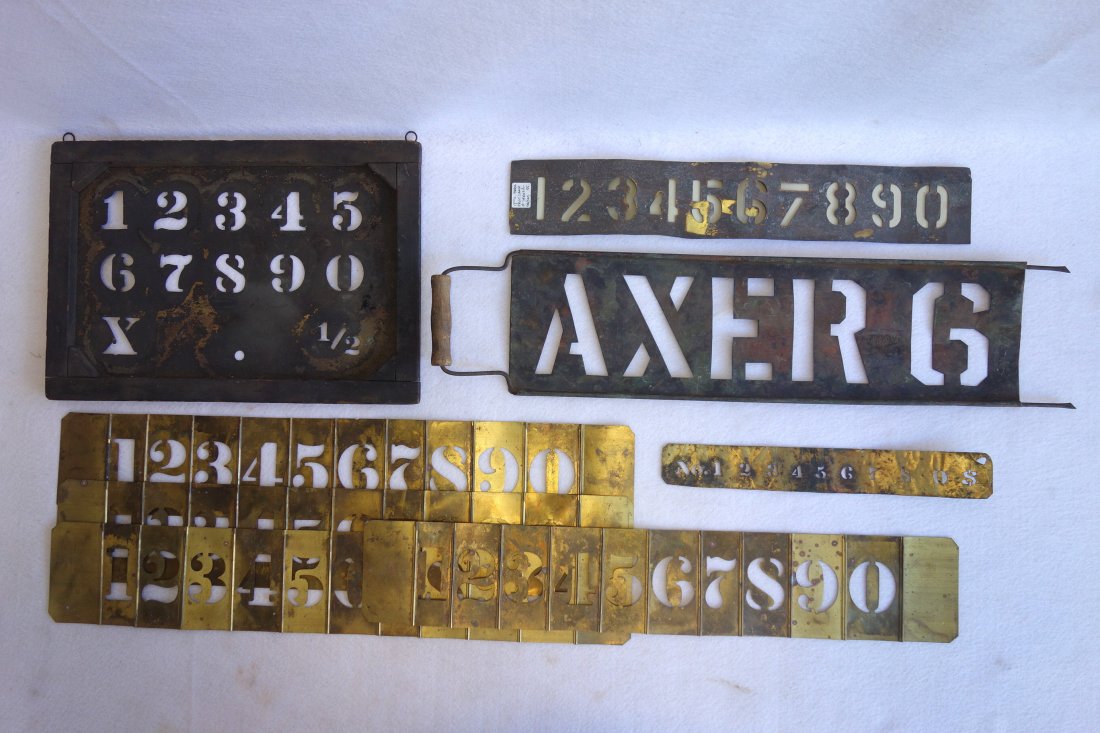Grouping of 8 old brass stencils including one banner (1 of 3)