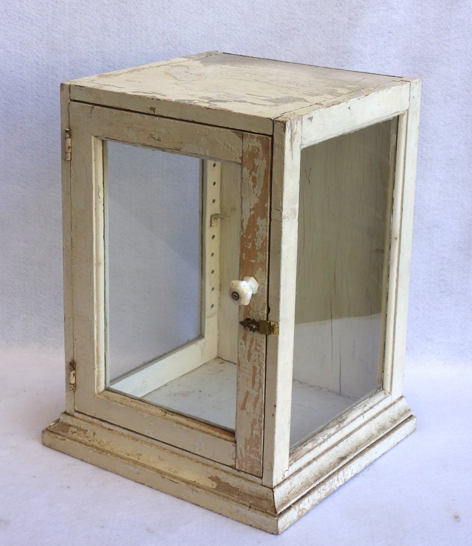 Small table top glass showcase with porcelain knob. (1 of 2)