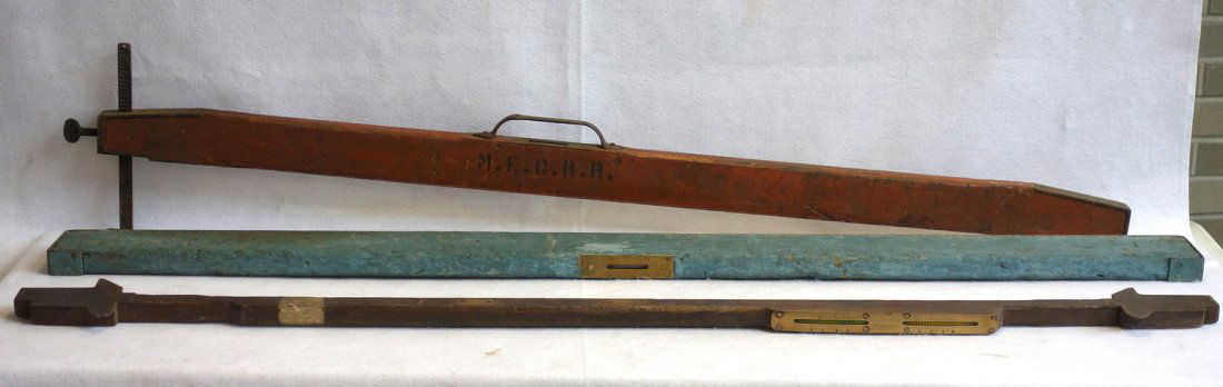 Three railroad track levels, one in orange paint signed (1 of 6)