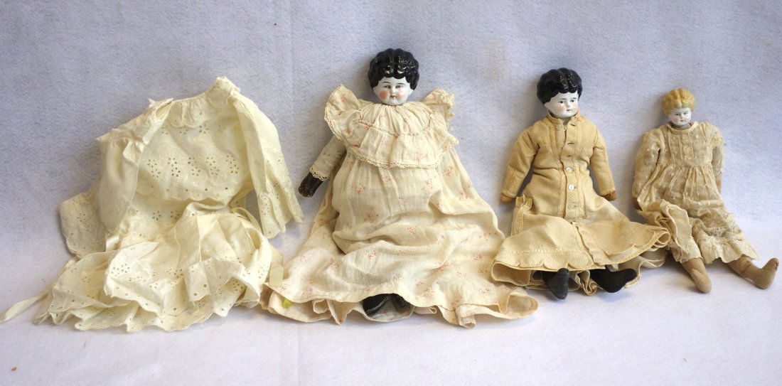 Three porcelain shoulder head china dolls with cloth (1 of 6)