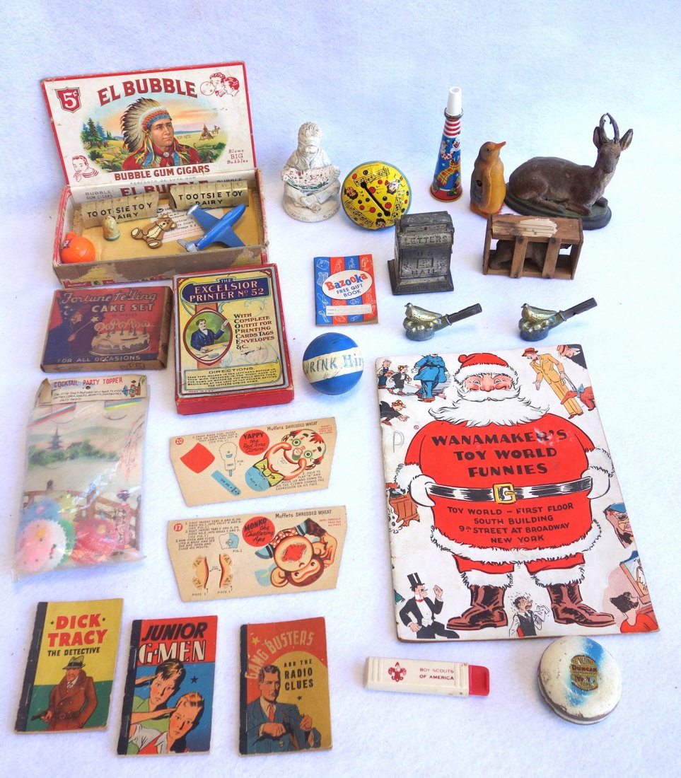 Grouping of miscellaneous toy collectibles including 2: Grouping of miscellaneous toy collectibles including 2 German whistles with bird finials, Fortune Telling Cake Set in original box, Bubble Gun Cigar box, Wanamaker's Toy World Funnies, German bear in 