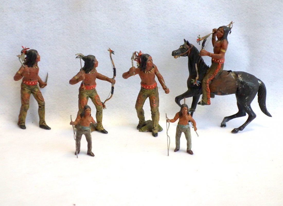 Grouping of 6 die-cast hand painted Indians and 1: Grouping of 6 die-cast hand painted Indians and 1 horse. The smallest Indian with broken hand, the others in good condition. Size range 3.5"H to 7.25"H.