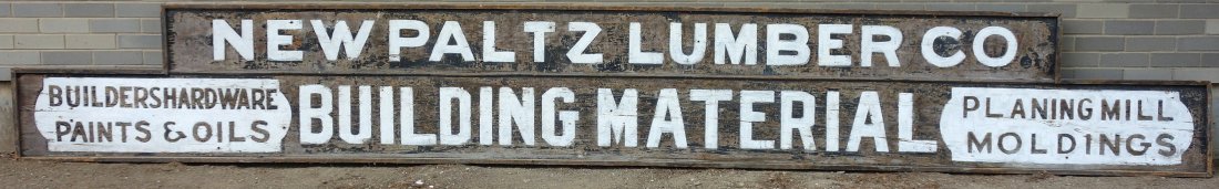 Large old lumber sign marked "New Paltz Lumber Co. /: Large old lumber sign marked "New Paltz Lumber Co. / Builders Hardware Paints & Oils / Building Material / Planing Mill Mouldings". Old white paint is probably 2nd paint, otherwise original condition.