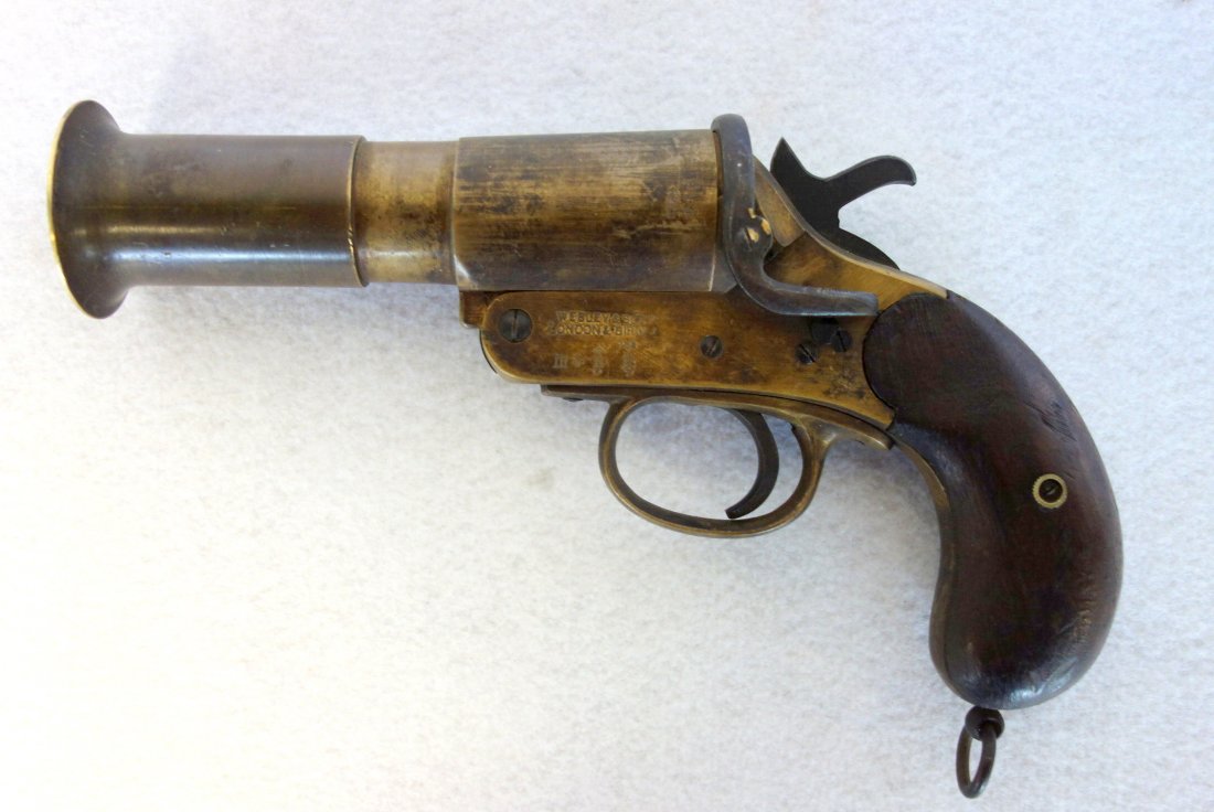 Old brass flare gun signed "Webley & Scott / London: Old brass flare gun signed "Webley & Scott / London Birmingham - touch marks on side plates. Wooden grips. Serial number 94821. Very good condition.