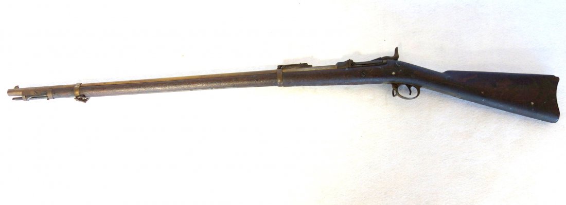 US Springfield trap door rifle Model 1884. Lock plate: US Springfield trap door rifle Model 1884. Lock plate stamped with eagle and US Springfield. Original grungy aligatored finish. 31.5" barrel length. Cleaning rod present. Barrel at breech end stamped 